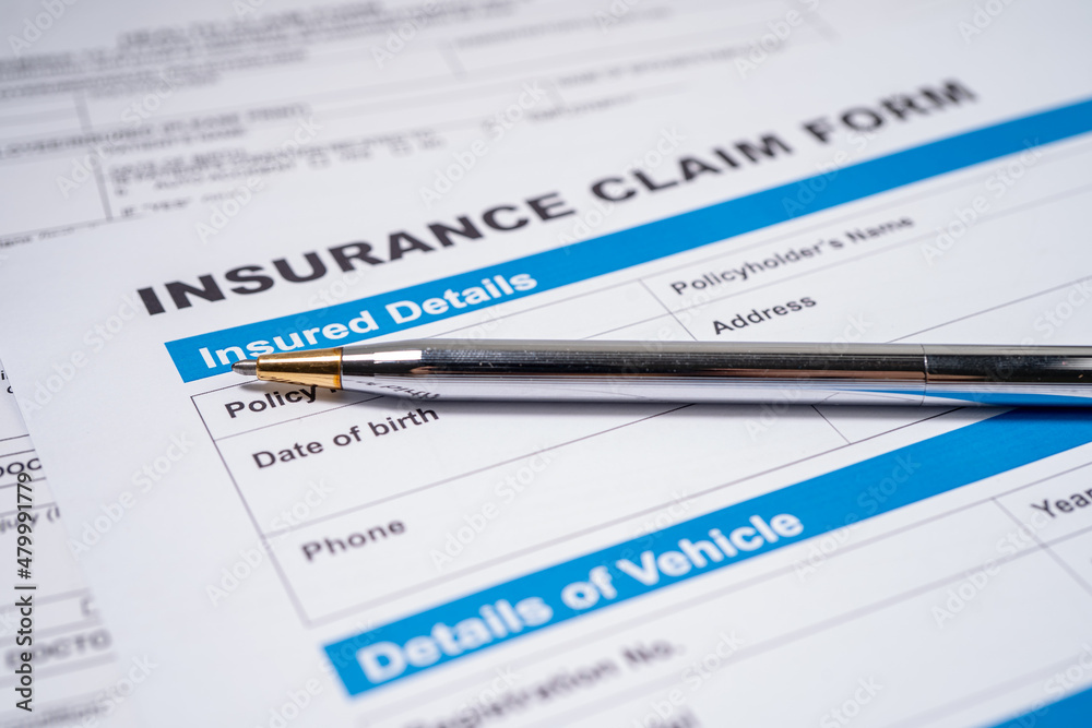 Pen on Insurance claim accident car form, Car loan, insurance and leasing time concepts.