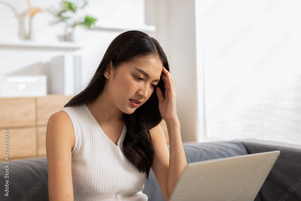 Business Asian woman have a Migraine so headache and stresses have a trouble and problem of her work.Frustrated woman.Office syndrome concept Business Asian woman have a Migraine so headache and stresses have a trouble and problem of her work.Frustrated woman.Office syndrome concept