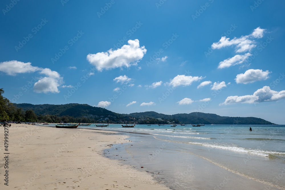 Obraz premium Kata beach in Phuket, Thailand, beach with clear water, white and golden sand, blue sky, in tropical vacation area. a beach holiday photo with copyspace.