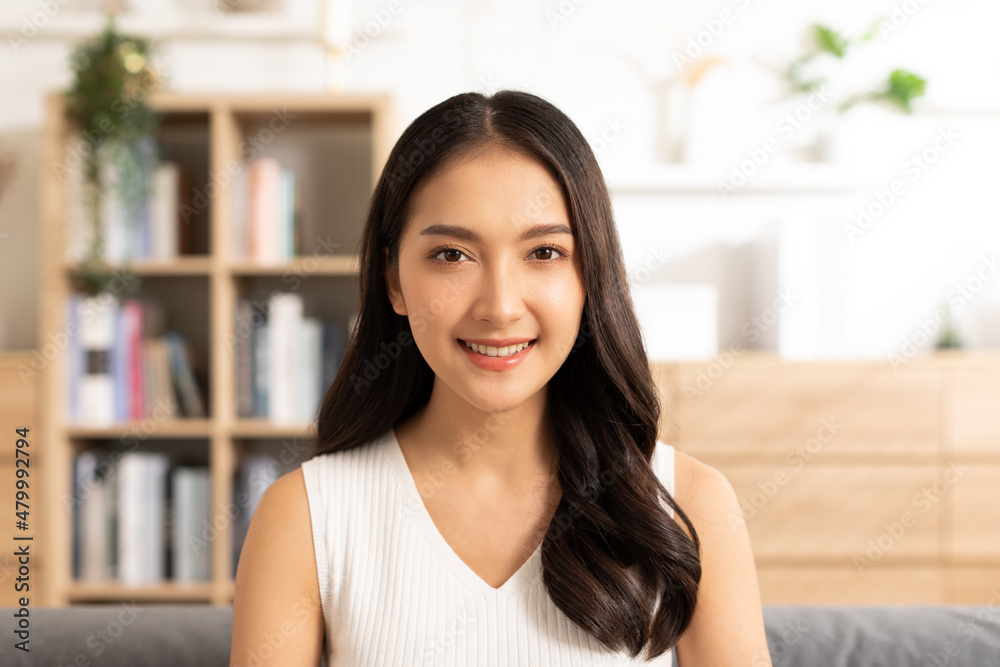 Portrait of happy beautiful asian woman look at camera smile with positive emotional.Smart confident freelance woman smiling happiness with work at home or study young woman video call study online. Portrait of happy beautiful asian woman look at camera smile with positive emotional.Smart confident freelance woman smiling happiness with work at home or study young woman video call study online.