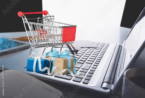 Black friday mini shopping bags in cart on the keyboard Online delivery services