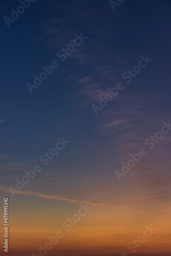 Twilight sky vertical with dark blue and colorful sunlight clouds, Dusk sky background