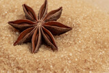 Star anise on brown sugar.