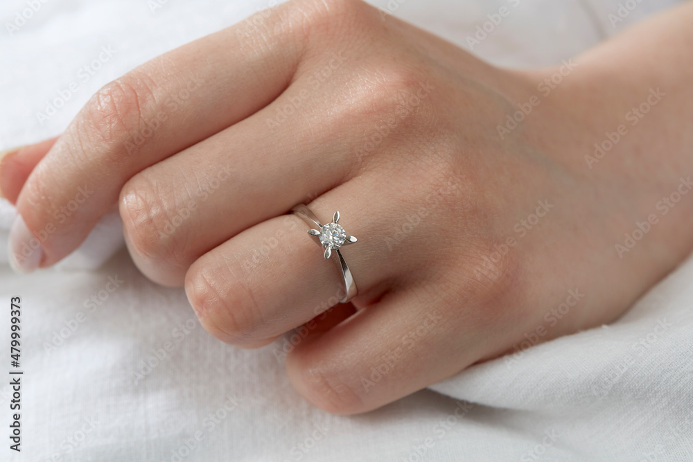 Jewelry background. Diamond ring on woman hand Jewelry background. Diamond ring on woman hand