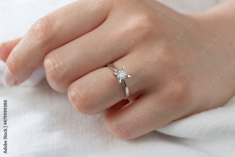 Jewelry background. Diamond ring on woman hand Jewelry background. Diamond ring on woman hand