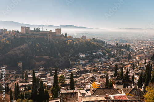 A view from Granada of the Alhambra from Paseo de los Tristes. It s a sunny day in Granada in december 2021