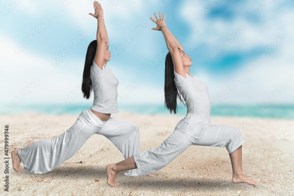 Young group of woman practicing yoga exercise at the beach near water. Young group of woman practicing yoga exercise at the beach near water.