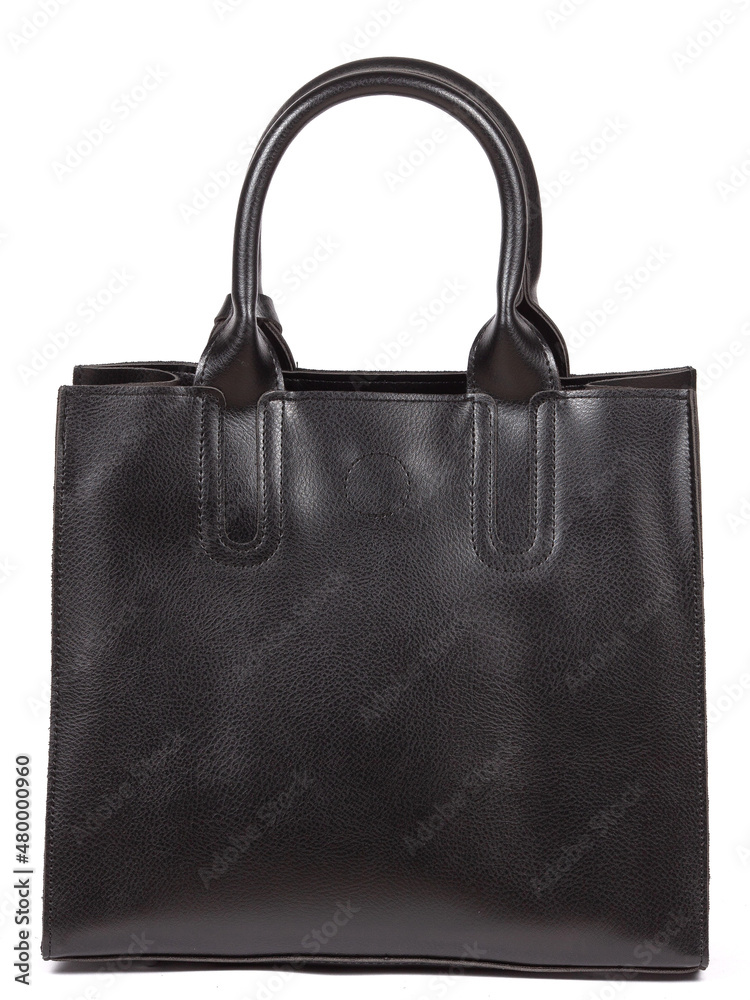 Black large with strap leather woman's handbag isolated on white background Black large with strap leather woman's handbag isolated on white background