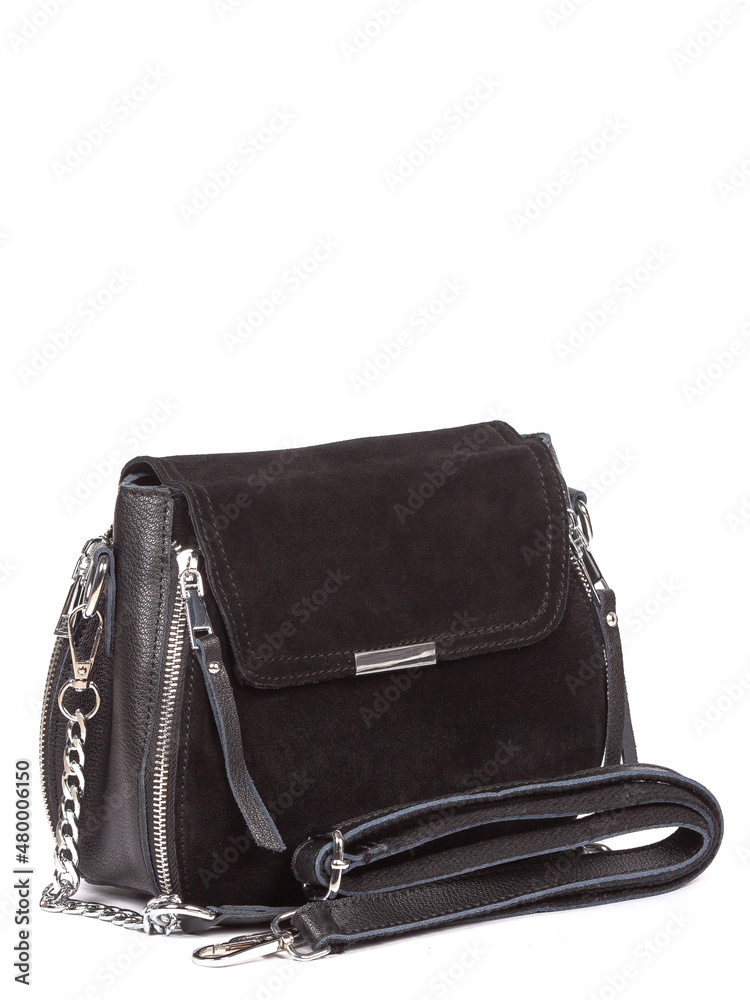 Small black leather woman's fashion handbag with strap isolated on white background Small black leather woman's fashion handbag with strap isolated on white background