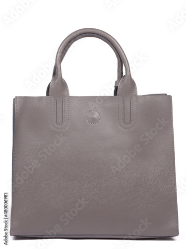 Grey leather woman's handbag with strap isolated on white background