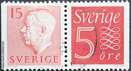 Sweden - circa 1957: a postage stamp from Sweden showing a portrait of King Gustaf VI Adolf and number 5 with decoration. photo
