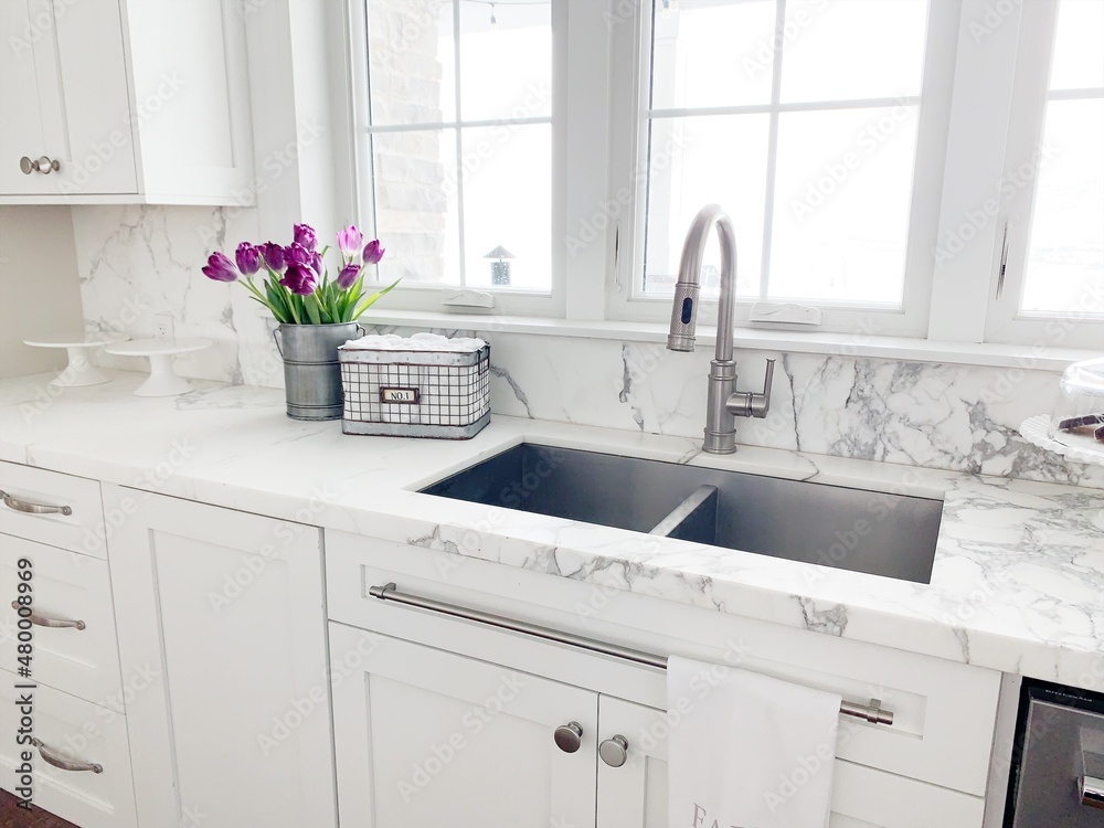 Fototapeta premium white marble kitchen sink with flowers
