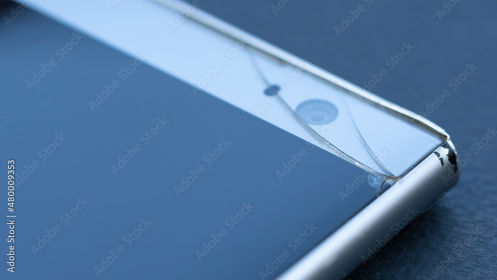 Crack on the smartphone screen macro photography. Broken touchscreen of the phone. Repair of phones and gadgets service. Crack on the smartphone screen macro photography. Broken touchscreen of the phone. Repair of phones and gadgets service.