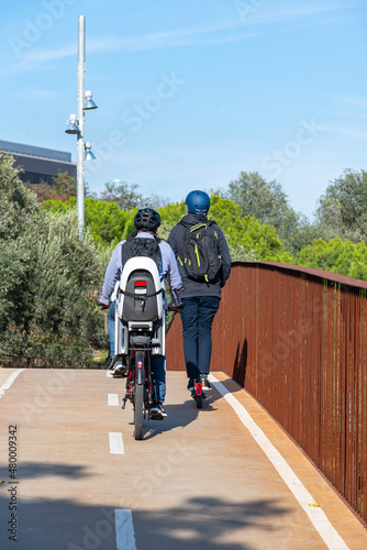 People circulating on the bike lane in the city of Barcelona