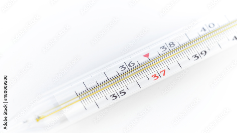 Glass mercury thermometer macro photography. High fever in viral diseases. Measurement of basal temperature during ovulation. Glass mercury thermometer macro photography. High fever in viral diseases. Measurement of basal temperature during ovulation.
