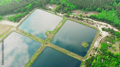 Aerial View Retention Basins, Wet Pond, Detention Basin Or Stormwater Management Pond, Is Artificial Pond With Vegetation Around The Perimeter, And Includes A Permanent Pool Of Water In Its Design 4K photo