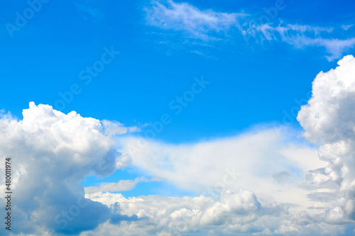 Blue sky with white cumulus clouds. Banner. Background. Nature wallpaper. Sunny weather forecast. Religion concept. Heaven landscape. Outdoor scenic. Bright pattern design. Copy space. Fresh air