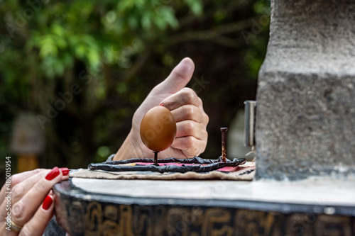 the zero point of the Equator and the action of physical laws - the balance of an egg on a nail head  photo