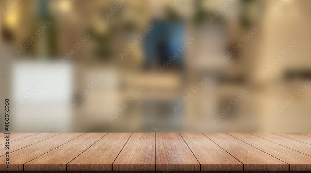 Empty wooden table top with lights bokeh on blur restaurant background. Empty wooden table top with lights bokeh on blur restaurant background.