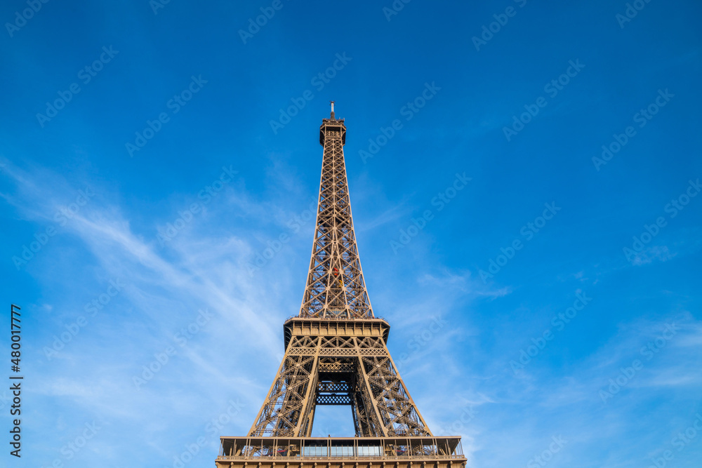 Eiffel Tower and bright blue sky in Paris, France. Copy space for your text.
