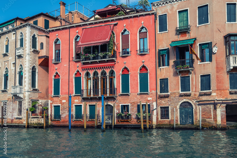 Colorful facades of old medieval houses in Venice, Italy. View on Grand canal picturesque landscape. Retro vintage Instagram style filter effect.
