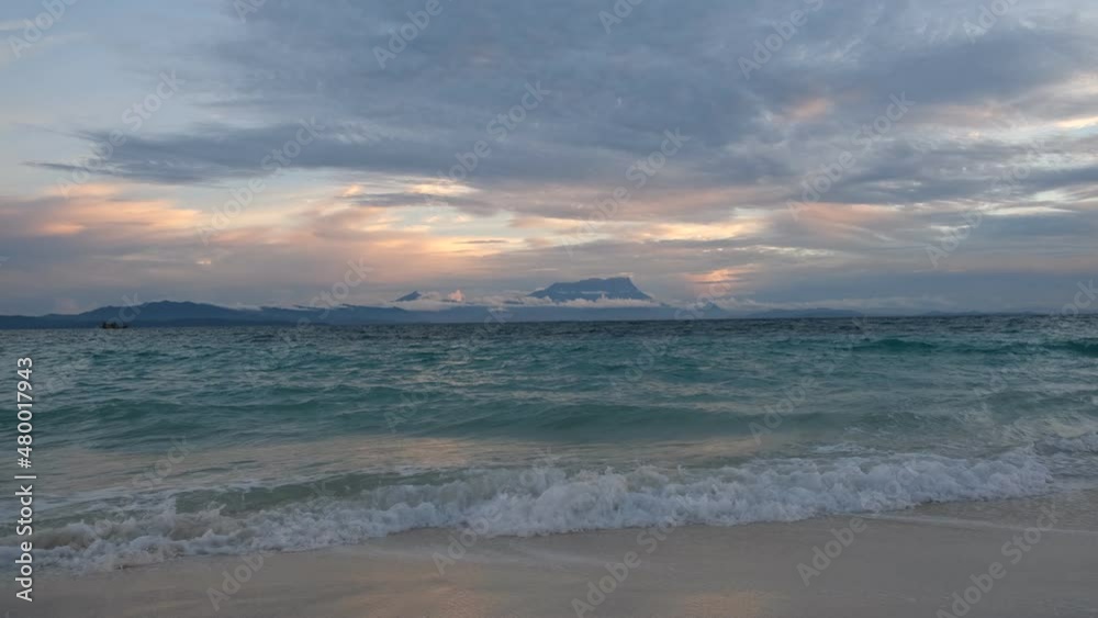 The Mantanani Islands form a small group of three islands off the north-west coasThe Mantanani Islands fort of the state of Sabah, Malaysia, opposite the town of Kota Belud. Sunset time at the island. The Mantanani Islands form a small group of three islands off the north-west coasThe Mantanani Islands fort of the state of Sabah, Malaysia, opposite the town of Kota Belud. Sunset time at the island.