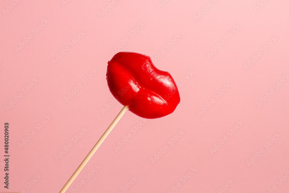 Red Lip-shaped Lollipop on a pink background Red Lip-shaped Lollipop on a pink background