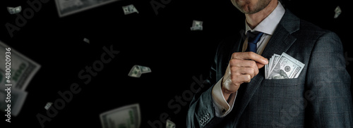 Money stack. Business man hand holding American money. Washington cash, usd falling banner.