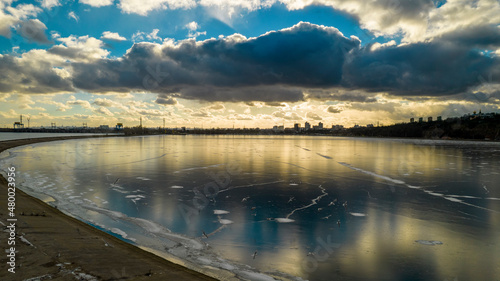 Aerial view of a frozen lake at sunset