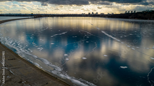 Aerial view of a frozen lake at sunset