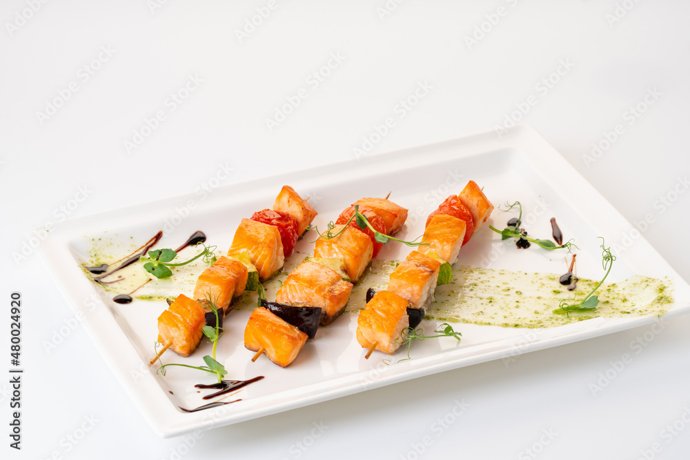 grilled salmon on a skewer with vegetables. Grilled seafood grilled salmon on a skewer with vegetables. Grilled seafood