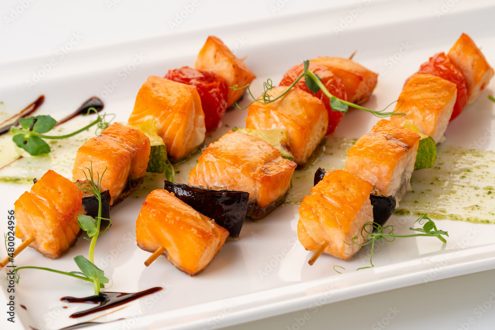 grilled salmon on a skewer with vegetables. Grilled seafood grilled salmon on a skewer with vegetables. Grilled seafood