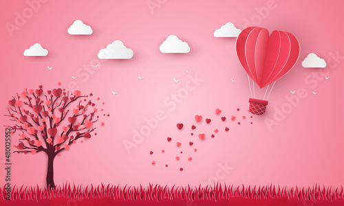 heart balloon flying over grass in paper cut. Happy Valentine's Day, Women's, Mother's greeting card. tree love romantic on pink background. vector illustration in paper art style.