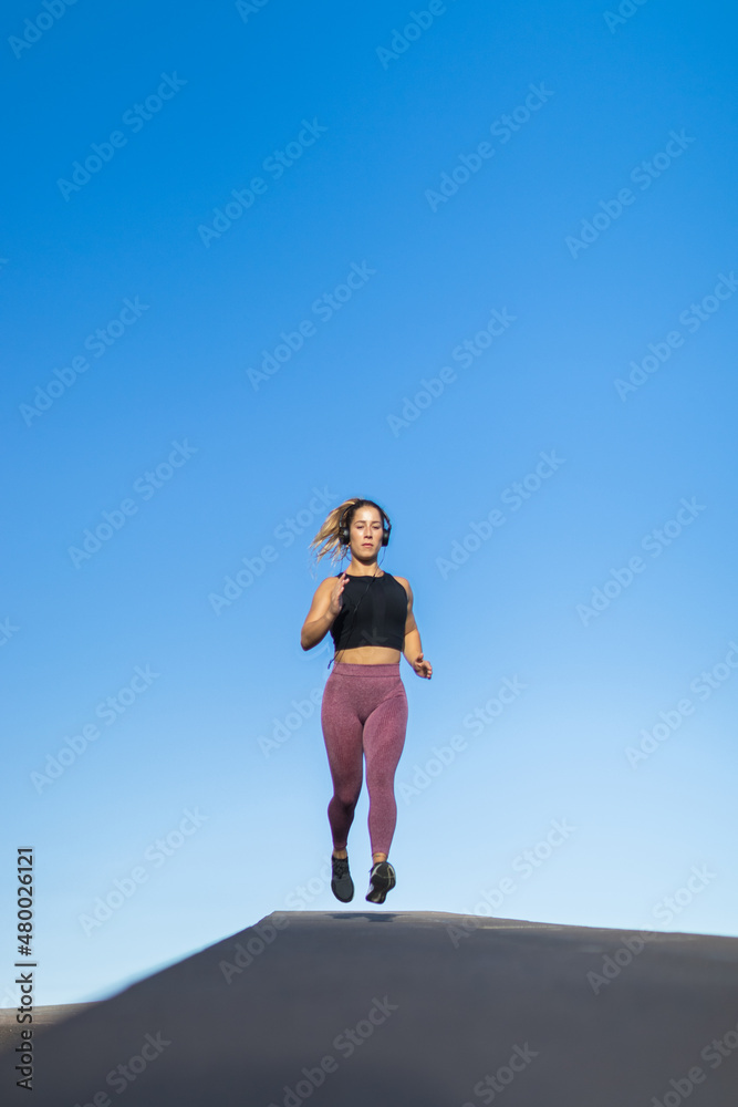 woman suspended in the air while she runs
