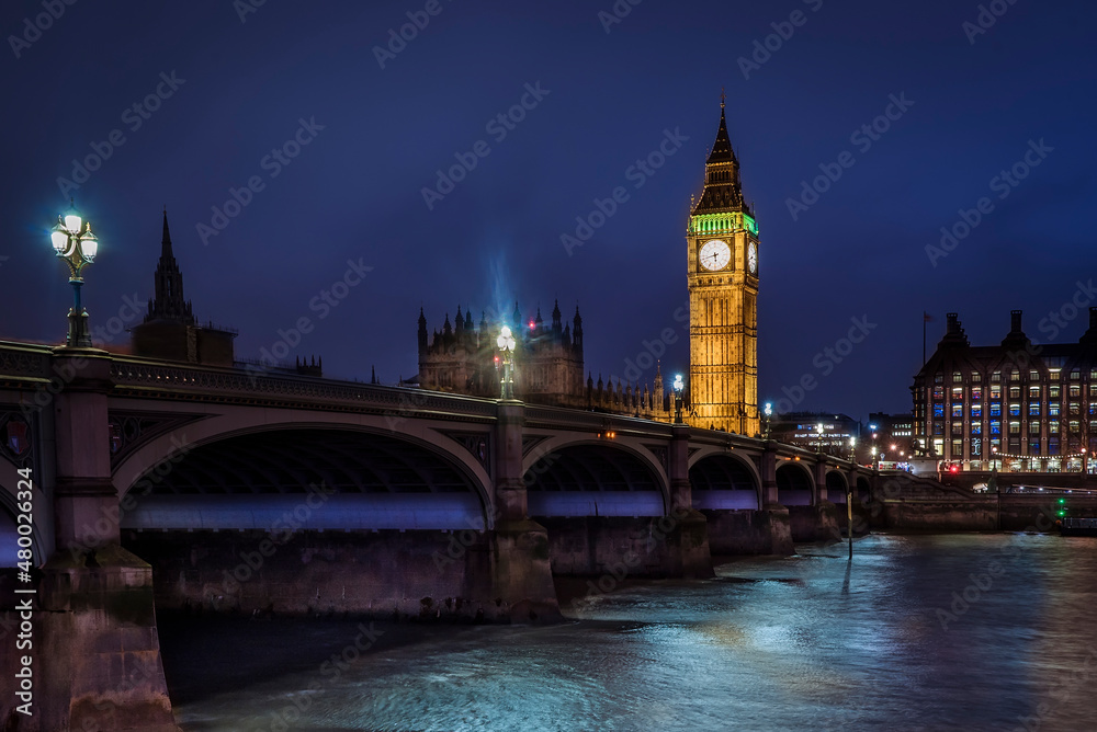 Panorama Westminster Bridge, Big Ben Tower with clock, evening, lights, river Thames, district of London, UK.