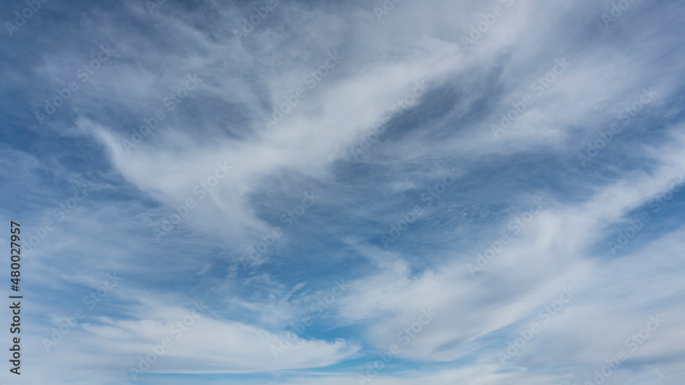 WIspy clouds and blue sky suitable for background or sky replacement