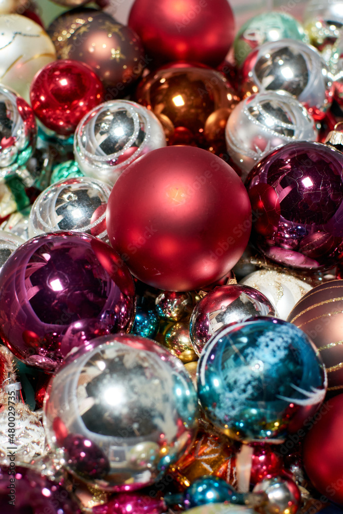 A vertical shot of colorful Christmas tree balls