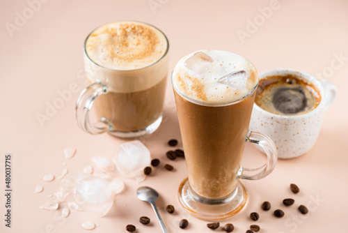 Ice coffee latte in glass cup, espresso cup and cappuccino. Various coffee drinks