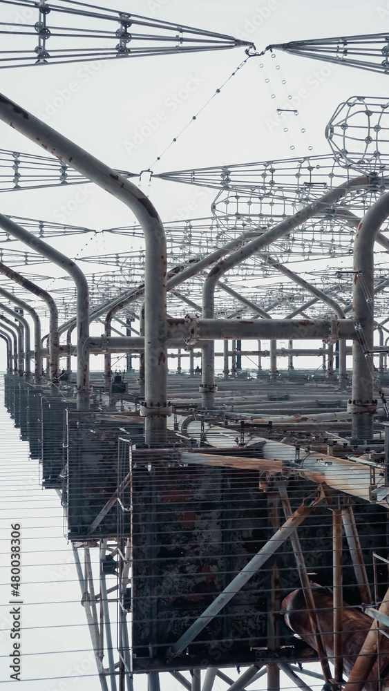 bottom view of metal radar tower in chernobyl exclusion zone.