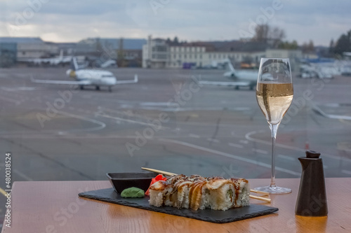 Luxury and wealth, private jet with sushi, rolls, chinese food in the airpot in the background