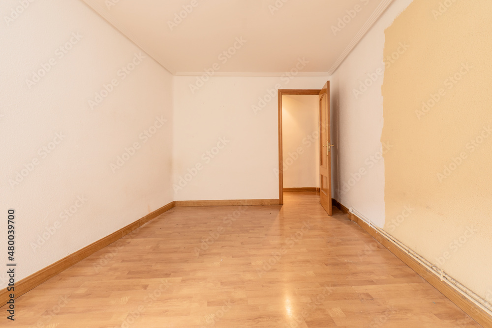 Empty and half-painted room in a residential home Empty and half-painted room in a residential home