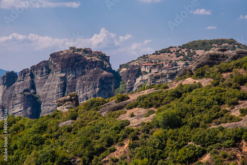 Beautiful landscape of Meteor mountain with rock formations and religious stone monastery on top of a cliff in summer holiday, Kalabaka, Greece.