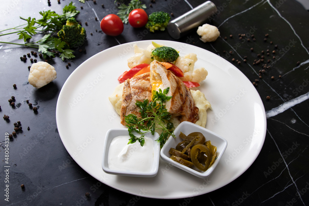 White plate and fried chicken with special sauce