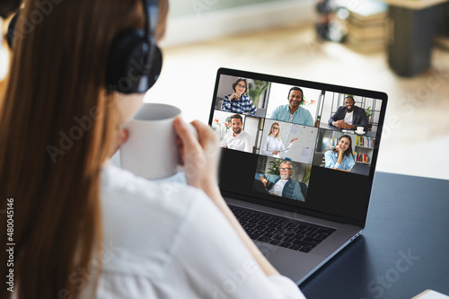 Online business meeting, remote work using laptop computer via video call. Successful caucasian freelancer woman takes part in video conference with employees. Distant working, online learning at home © kucherav