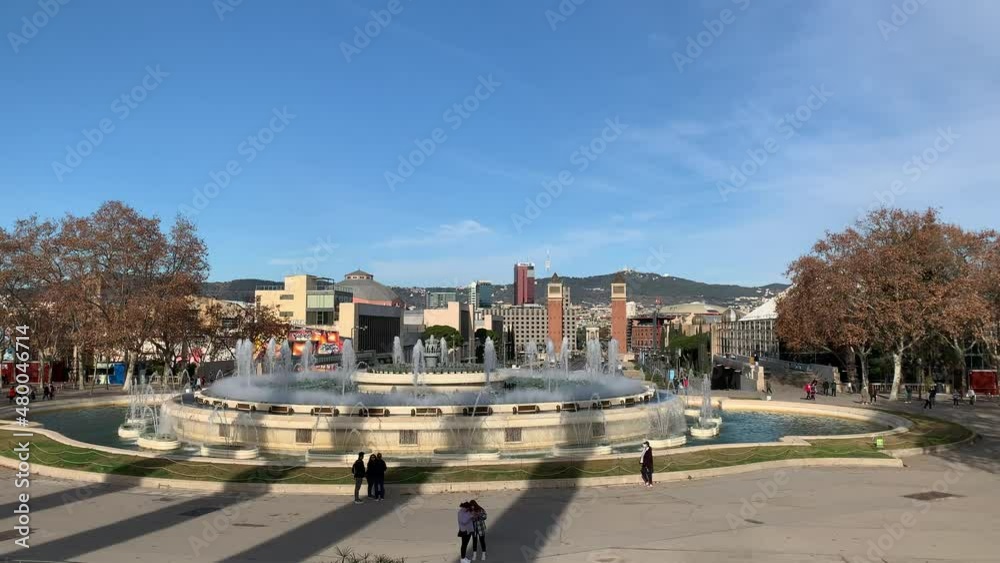 Day time view of Magic fountain of Montjuic. Motion of water sprinkles. This fountain is famous for shows. It is located in front of placa d'Espanya and Palau national. Barcelona, Catalonia, Spain