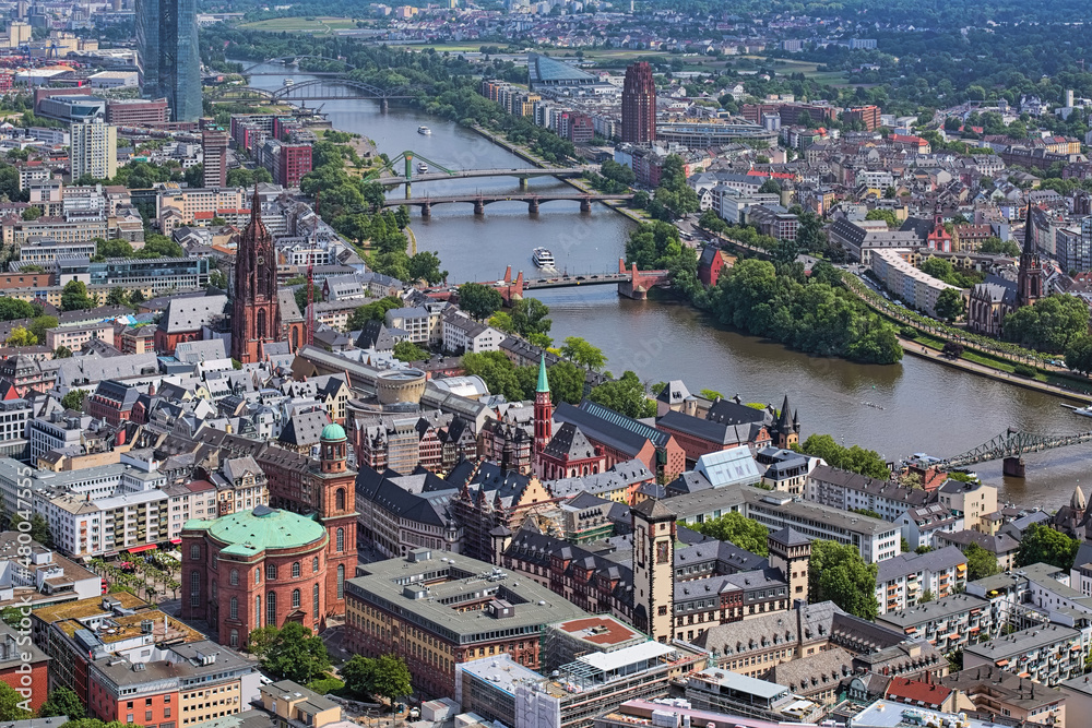 Frankfurt am Main, Germany. High angle view on Old Town with St Paul's Church, Romer, Old St Nicholas Church, Frankfurt cathedral and Main river. View from observation deck of Main Tower skyscraper.