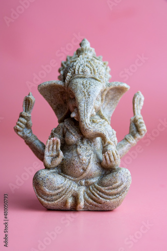 Hindu God Ganesha. Ganesha Idol on pink background.