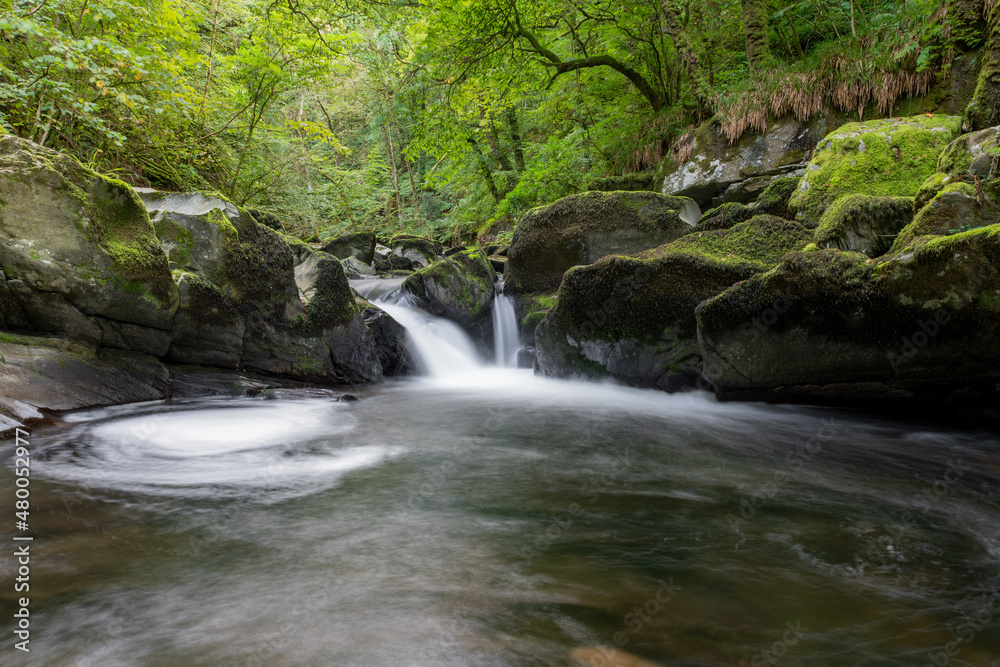 Long exposure of a waterfall on the East Lyn River at Watersmeet in Exmoor National Park