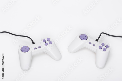 Wallpaper Mural Two video game joysticks on white background, closeup. Game addicted concept. Torontodigital.ca