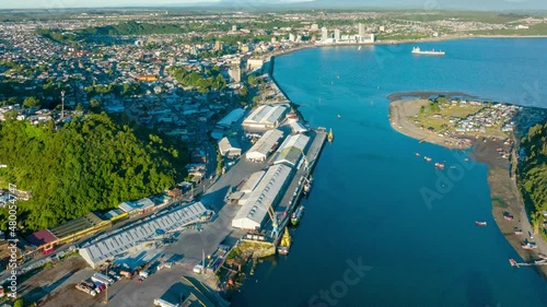 Aerial Time lapse Over Tenglo channel With Bay Of Puerto Montt With downtown Seen In Distant Background. Dolly Right photo